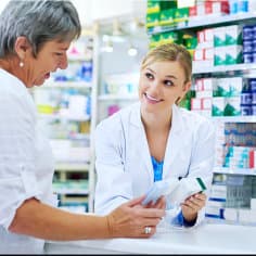 pharmacist talking to her customer